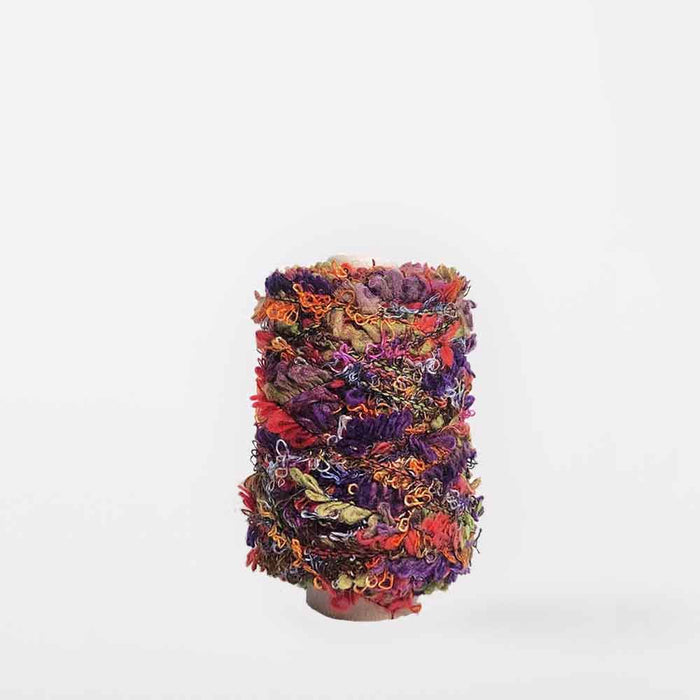 Mondofil Sesamo boucle yarn cone in Vibrant Mix for textured weaving