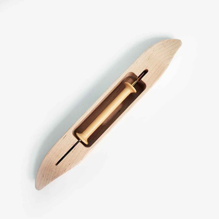 Leclerc closed-bottom weaving shuttle with 4-inch styrene bobbin, top view