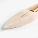 Close-up of the pointed end of a Leclerc maple weaving shuttle with smooth finish