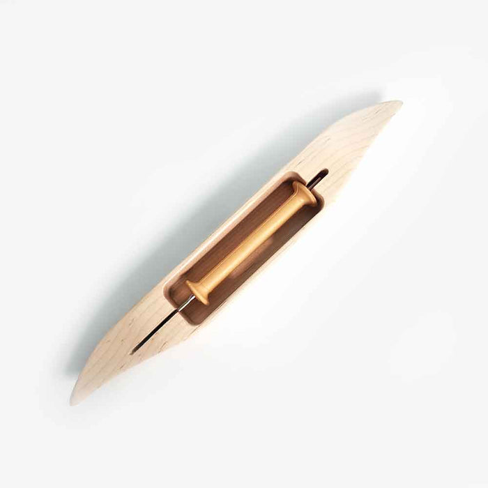 Leclerc maple weaving shuttle showing bobbin cavity and closed bottom design