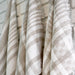Close-up of natural and white linen yarns in woven dish towel