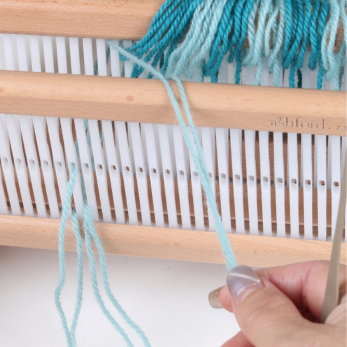 Threading the second rigid heddle during loom preparation