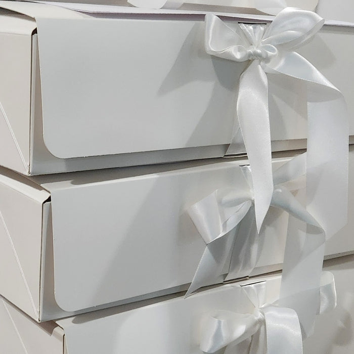 Elegant white gift boxes prepared for the 2026 Textile Advent Calendar