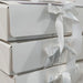 Elegant white gift boxes prepared for the 2026 Textile Advent Calendar