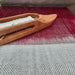 Layered double weave in progress with shuttle on a four-shaft loom