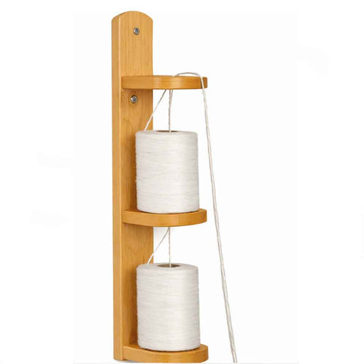 Wall-mounted wooden yarn doubler made of maple wood, showing two spools of white yarn used to twist multiple threads together