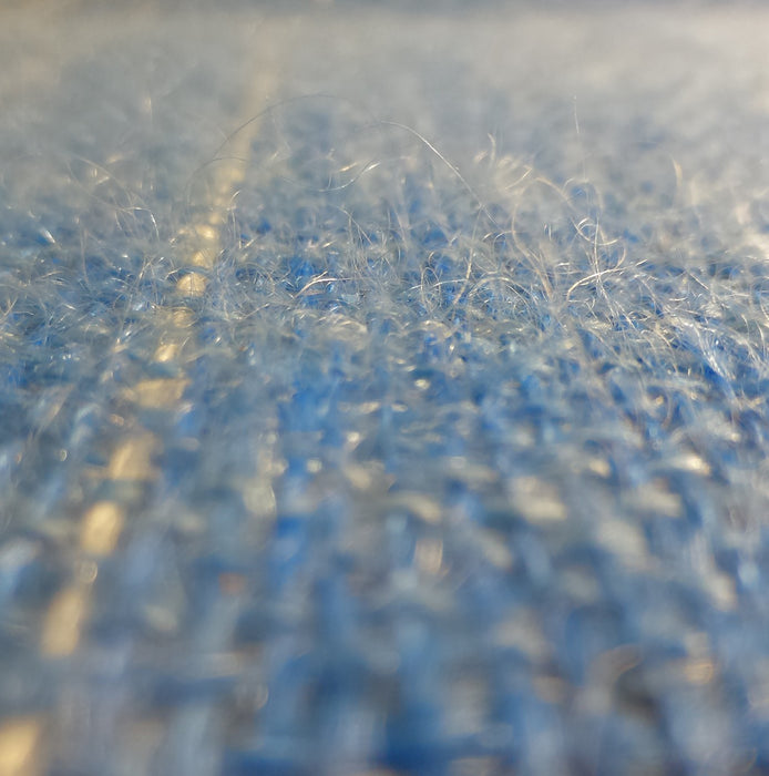 Close-up of handwoven mohair and silk fabric showing airy texture and soft halo
