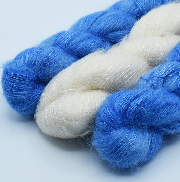 Mohair and silk yarn in natural and hand-dyed in blue color used for Mediterranean stole