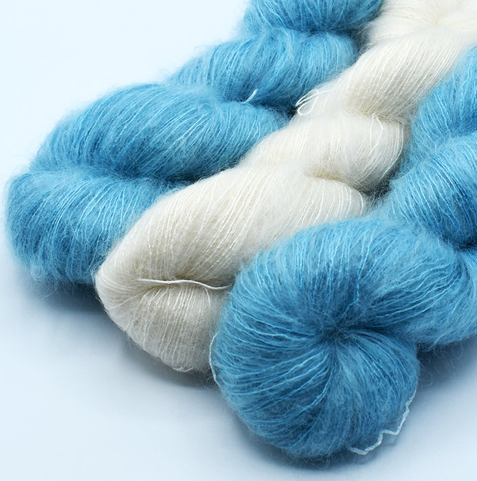 Mohair and silk yarn in natural and hand-dyed sarcelle colors used for Mediterranean stole