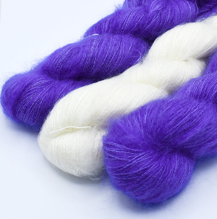 Mohair and silk yarn in natural and hand-dyed in violet colors used for Mediterranean stole